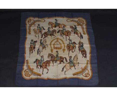A HERMÈS SCARF - "REPRISE" Silk twill, rolled edges and signed Le Doux, 90 X 90 cm. Marked and damaged. (1) 