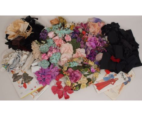 A BOX VINTAGE SILK FLOWERS AND MIXED HABERDASHERY A collection of vintage corsages and boxes of vintage ribbons etc. (quantit