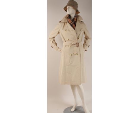 A 1980'S 'BURBERRYS' RAINCOAT, HAT AND SCARF In good condition. Underarm to underarm 18.5". A plaid wool scarf and two hats w