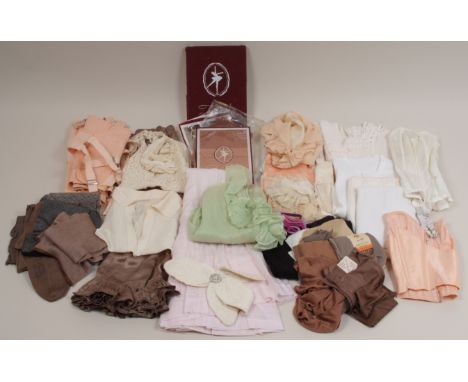 A COLLECTION OF VINTAGE UNDER GARMENTS  Corsets, vanity vests, silk stockings, woollen vests, all beautifully clean and in go
