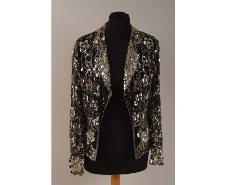 A 1980'S SEQUINED JACKET A French made jacket with silver sequins and bugle beads on a fine black mesh.  Sequined  Pockets, l