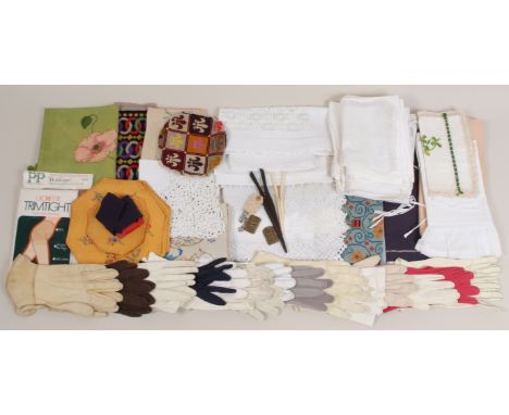 A MIXED COLLECTION OF TAPESTRIES, GLOVES, BOLSTER CASES. Kid gloves, glove stretchers, pretty pieces of tapestry and further 
