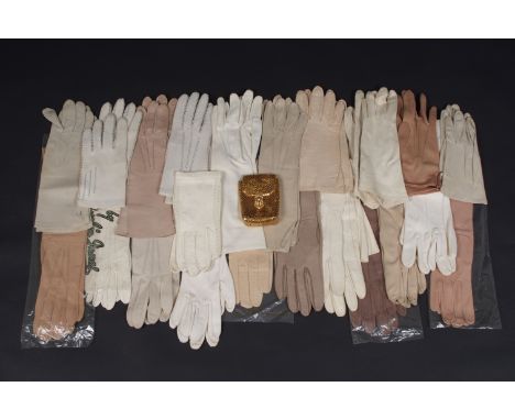 A BOX OF KID GLOVES AND DESIGNER SCARVES Many pairs of leather and kid day gloves together with five interesting Vintage scar
