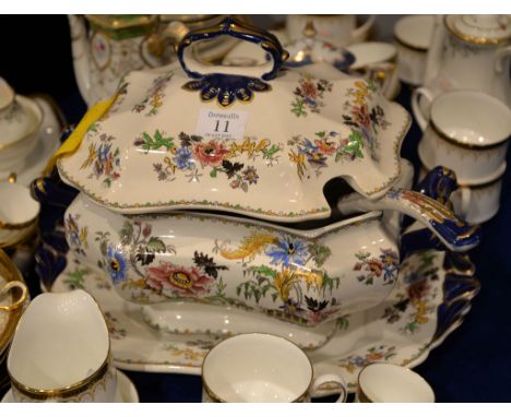 An English ironstone soup tureen with ladle, cover and stand in Indian plant pattern