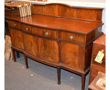 A mahogany bow fronted sideboard, first half 20th century, with Vitruvian scroll frieze, 95cm high (excluding upstand), 119cm