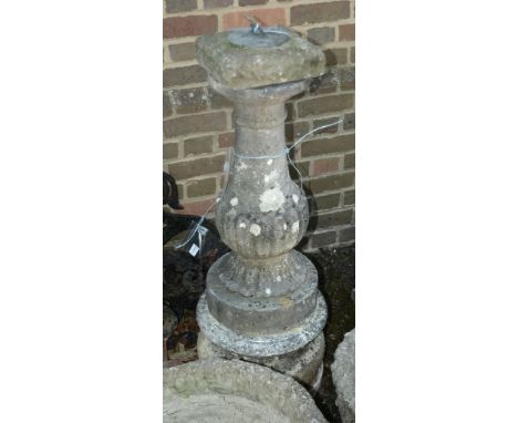 A stone composition plinth with associated metal sundial, 20th century, 110cm high overall