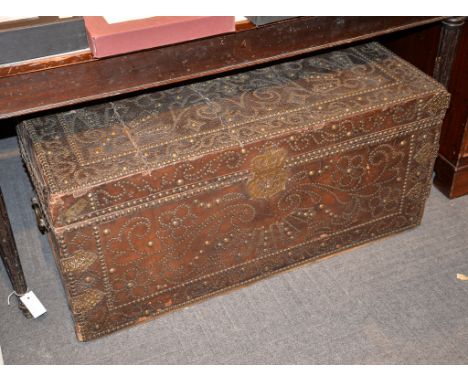 A leather bound and brass studded chest, first half 18th century, 51cm high, 107cm wide, 58cm deep