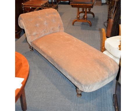A late Victorian mahogany and brown velvet button upholstered chaise longue, on turned supports, 187cm long,