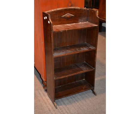 An oak hall cupboard with internal shelf and mirror to inside of door, on bun feet, circa 1930, 182cm high, together with an 