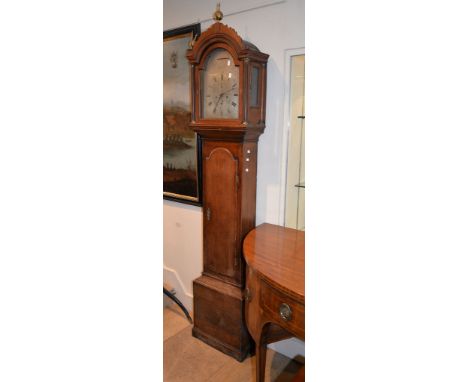 An oak longcase clock, with eight day bell striking movement, the arched silvered dial inscribed J. Coster Henley on Thames, 