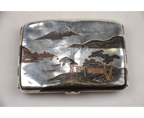 A Japanese mixed metal and silver cigarette case decorated with a watery landscape with Mount Fuji in the background Conditio