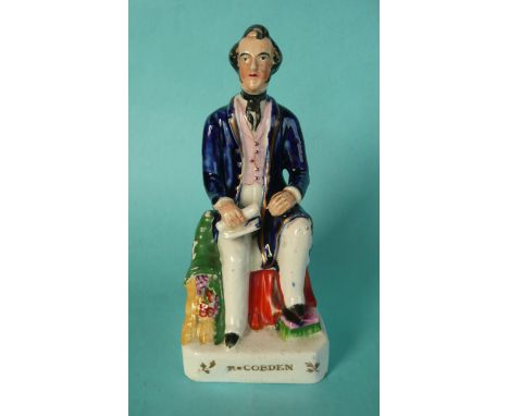 Richard Cobden: a colourful Staffordshire pottery figure depicted seated, the square base impressed with name, circa 1846, 19