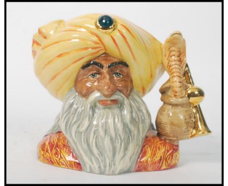 A Royal Doulton rare sample Character jug The Snake Charmer D6912. Sample painted base. Measures 17cms high.  Note; from an e