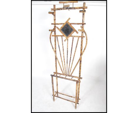 A 19th century Victorian Art Nouveau bamboo hallstand / hall stand. Central diamond mirror with vase detail having stick stan