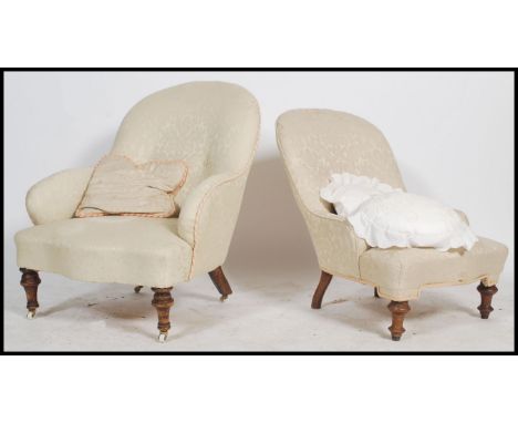 A pair of 19th century ladies and gents Victorian mahogany armchairs /&nbsp; chairs, button back upholstery raised on turned 