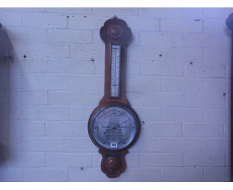 A walnut case aneroid barometer/thermometer Condition report: Working order