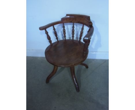 A late Victorian revolving desk chair with bobbin supports