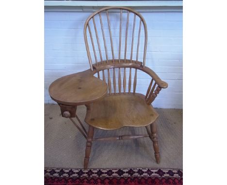 An antique style ash and elm stick back work chair raised on turned supports joined by stretchers