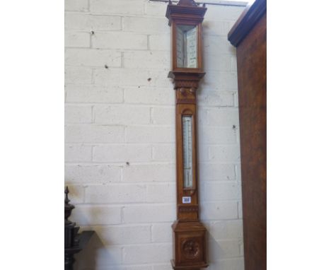 A 19th century oak cased stick barometer the dial signed Aronsberg & Co, 39 Castle Street, Liverpool - with a thermometer, no