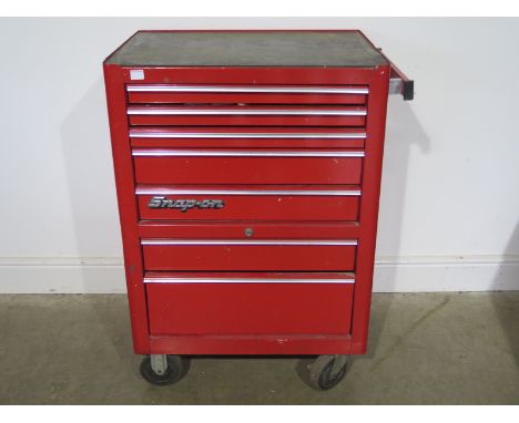 A snap on tool cabinet with a good selection of modern tools including some snap items