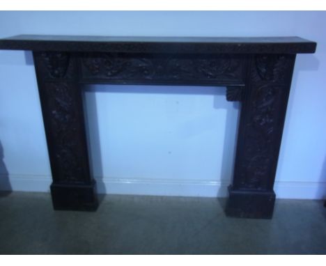A Victorian carved oak fire surround using old timbers - Height 120cm x 172cm x 30cm - hearth size 94cm x 96cm - missing a co