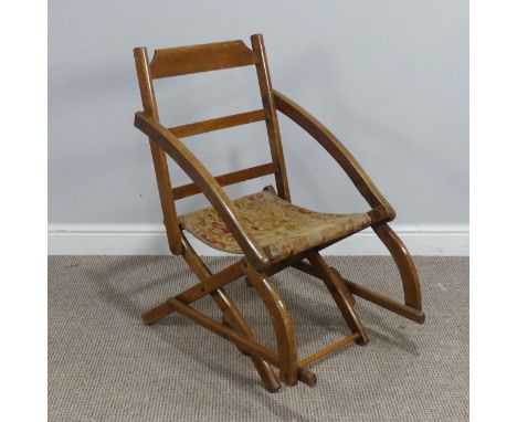 An early 20th century mahogany folding campaign Chair, with tapestry seat, W 49cm x H 80cm x D 73cm 