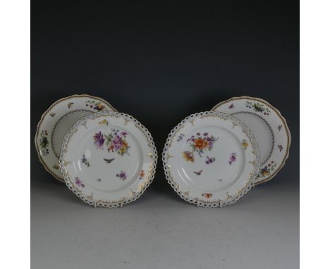 A pair of early 20thC KPM Berlin porcelain Cabinet Plates, with reticulated lace edge, enclosing central painted flora, blue 