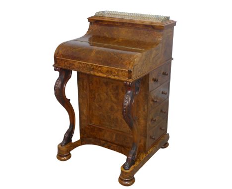 A Victorian burr walnut piano top Davenport Desk,&nbsp;the rectangular top with pierced brass three-quarter gallery,&nbsp;wit