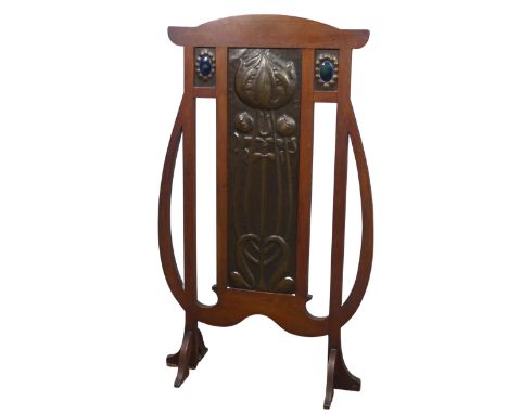 A Shapland and Petter of Barnstaple Art Nouveau mahogany and copper Firescreen, circa 1900, in the shape of an owl, embossed 