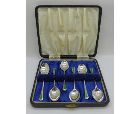 A set of six silver and enamel Art Deco spoons, cased, Birmingham 1922, 45g 