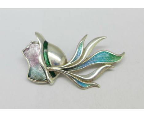 A hallmarked silver and enamel Art Deco style brooch depicting a lady wearing a hat, maker DJ, 44mm 