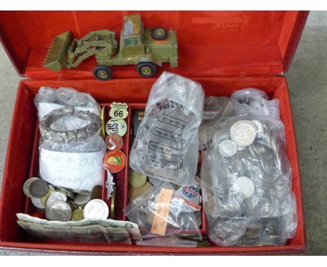 A collection of mainly foreign coins, badges, a Matchbox Tractor Shovel, etc. 