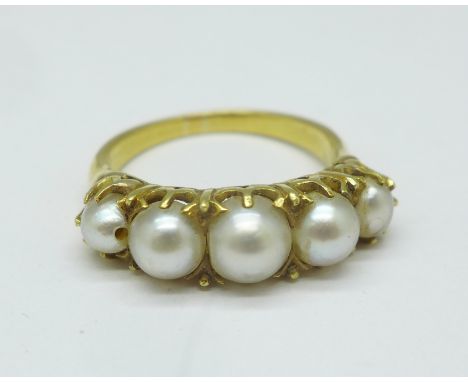 A yellow metal and pearl ring, tests as 18ct gold, 4.8g, M/N, one replacement pearl a/f