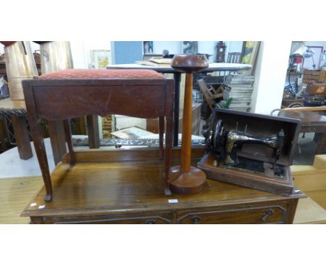 A mahogany piano stool, a smokers stand and a Singer sewing machine 