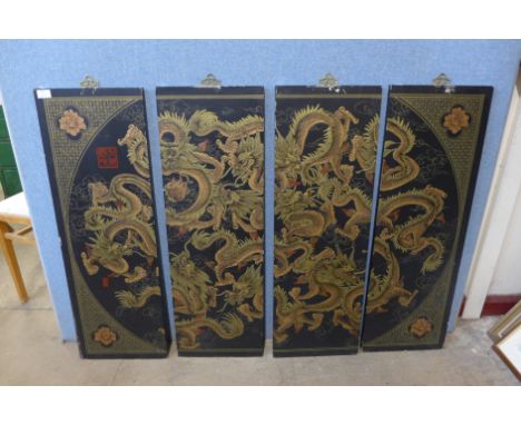 A Chinese four panel black lacquered chinoiserie wall hanging plaque 