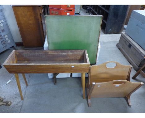 A teak magazine rack, folding card table and a planter 