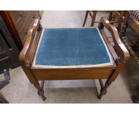 A mahogany piano stool 