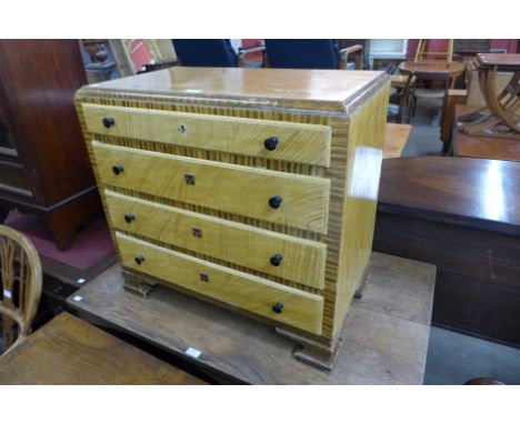 A Scandinavian Art Deco simulated walnut petit commode 