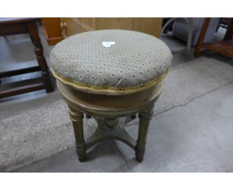A Victorian giltwood revolving piano stool 