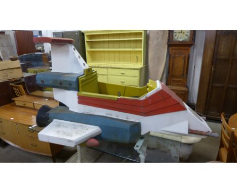 A vintage child's fairground ride rocket seat 