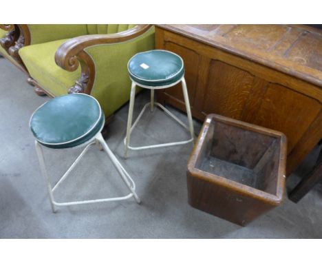 A teak planter and a pair of vintage steel and vinyl stools 
