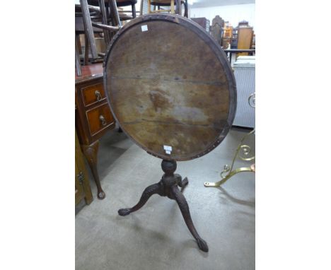 A George III Chippendale style mahogany circular tilt-top tripod table