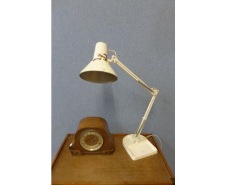 A painted cast iron based Danish anglepoise lamp and an oak mantel clock 
