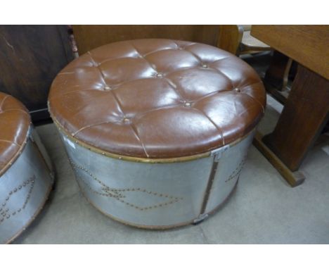 A brown leather and aluminium circular stool 