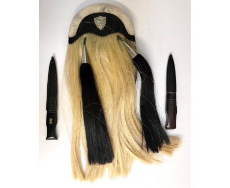 TWO-TASSELED SPORRAN BY LECKIE, GRAHAM & CO. OF GLASGOWleather and hair, white metal top and badge with deer motif of the Gor