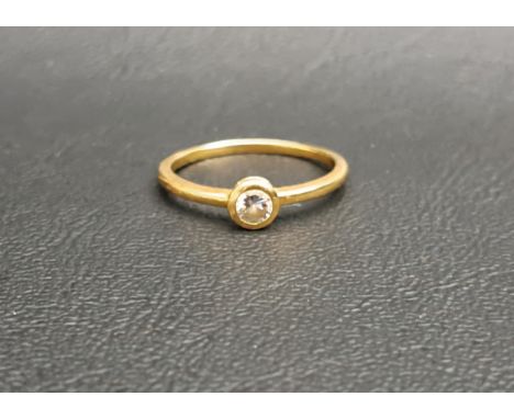 DIAMOND SINGLE STONE RINGthe bezel set diamond approximately 0.15cts, on eighteen carat gold shank, ring size M-N and approxi