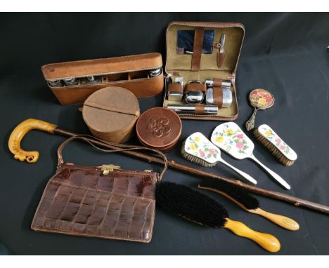 SELECTION OF VINTAGE COLLECTABLEScomprising two leather cased gentlemen's shaving sets containing various bottles, a crocodil