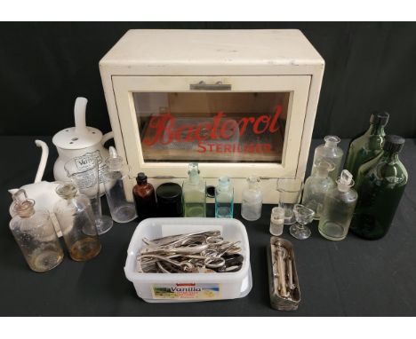 VINTAGE BACTEROL TABLE TOP STERILISERwith a selection of podiatry clippers, scissors, tweezers and other equipment; together 