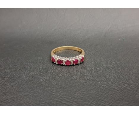 RUBY AND DIAMOND RINGthe five round cut rubies separated by double diamond spacers, on nine carat gold shank, ring size L