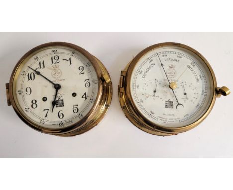 BRASS BULKHEAD CLOCK AND BAROMETER BY SEWILLS OF LIVERPOOLmounted in brass and inscribed 'Sewills 200 years 1800-1899 celebra